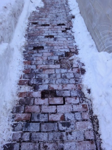 missing bricks from sidewalk